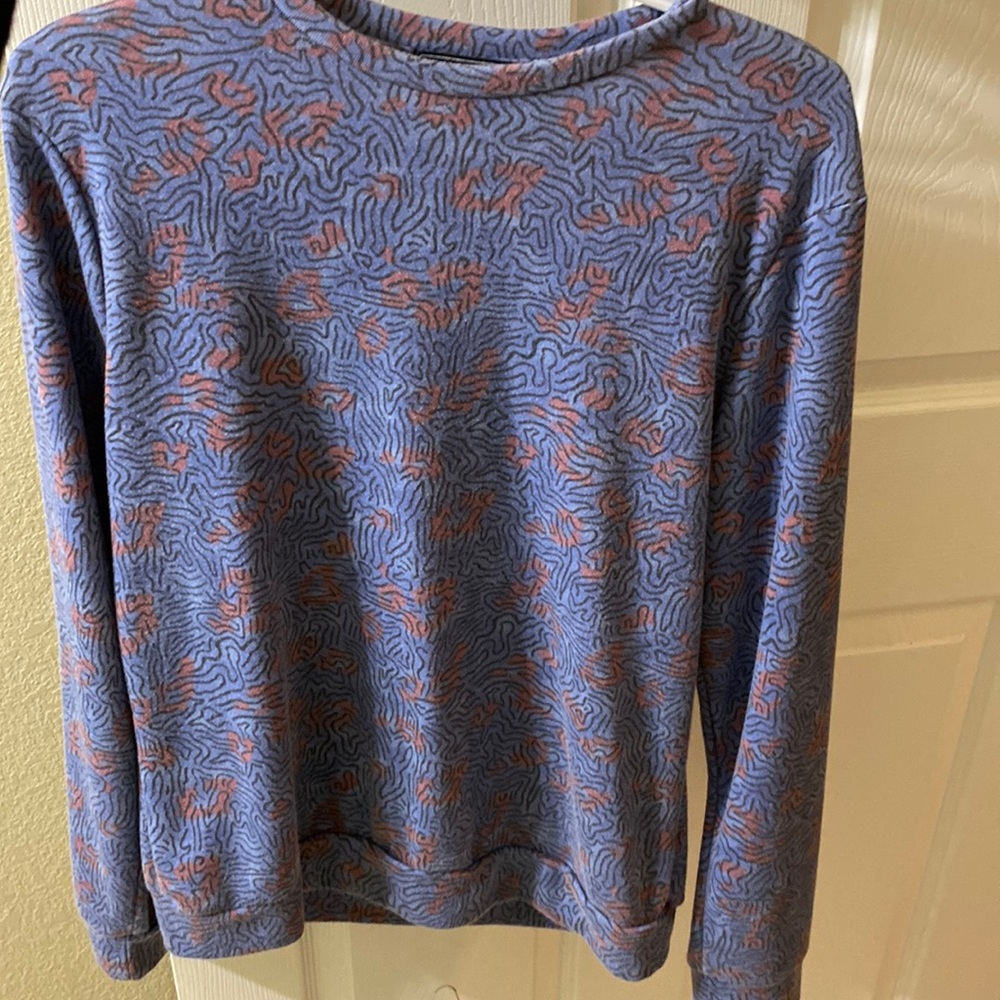 I am selling a 21men blue and orange sweater that is a size small.